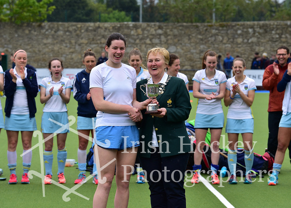 Clodagh Cassin presented goalkeeper of the tournament by Hockey Ireland's Ivy Dennis