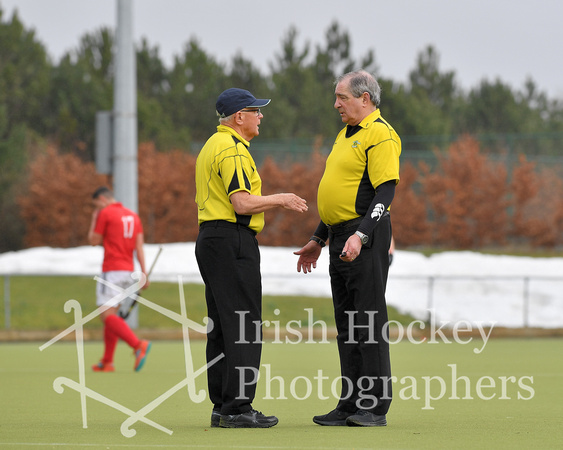 Umpires Crozier Deane and Percy Henchy
