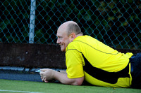 Umpire David Acheson sees the funny side after taking a slip