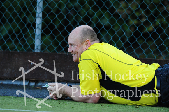 Umpire David Acheson sees the funny side after taking a slip
