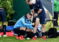 James Lorimer applies strapping to Andy Williamson's leg